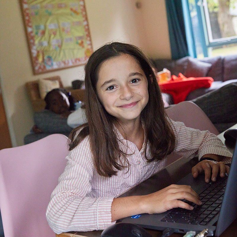 photo of a boarding student on a laptop