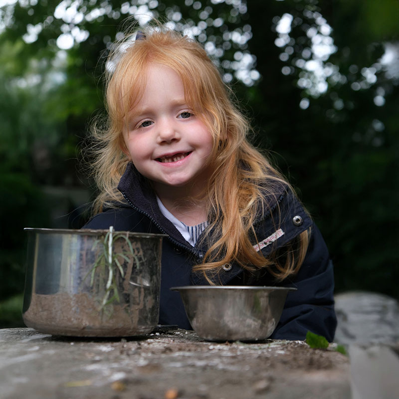 portrait of a nursery student outdoors