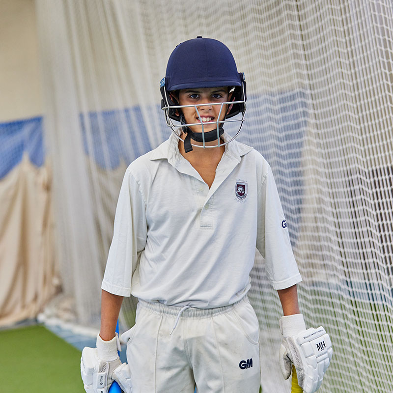 portrait of a student in a cricket uniform